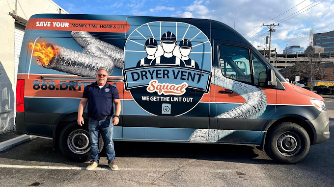 Dryer Vent Squad franchise owner in front of a branded service van